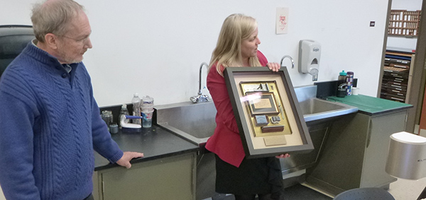 John Landis with Prof. Ann Lemon displaying the commemorative plaque. 